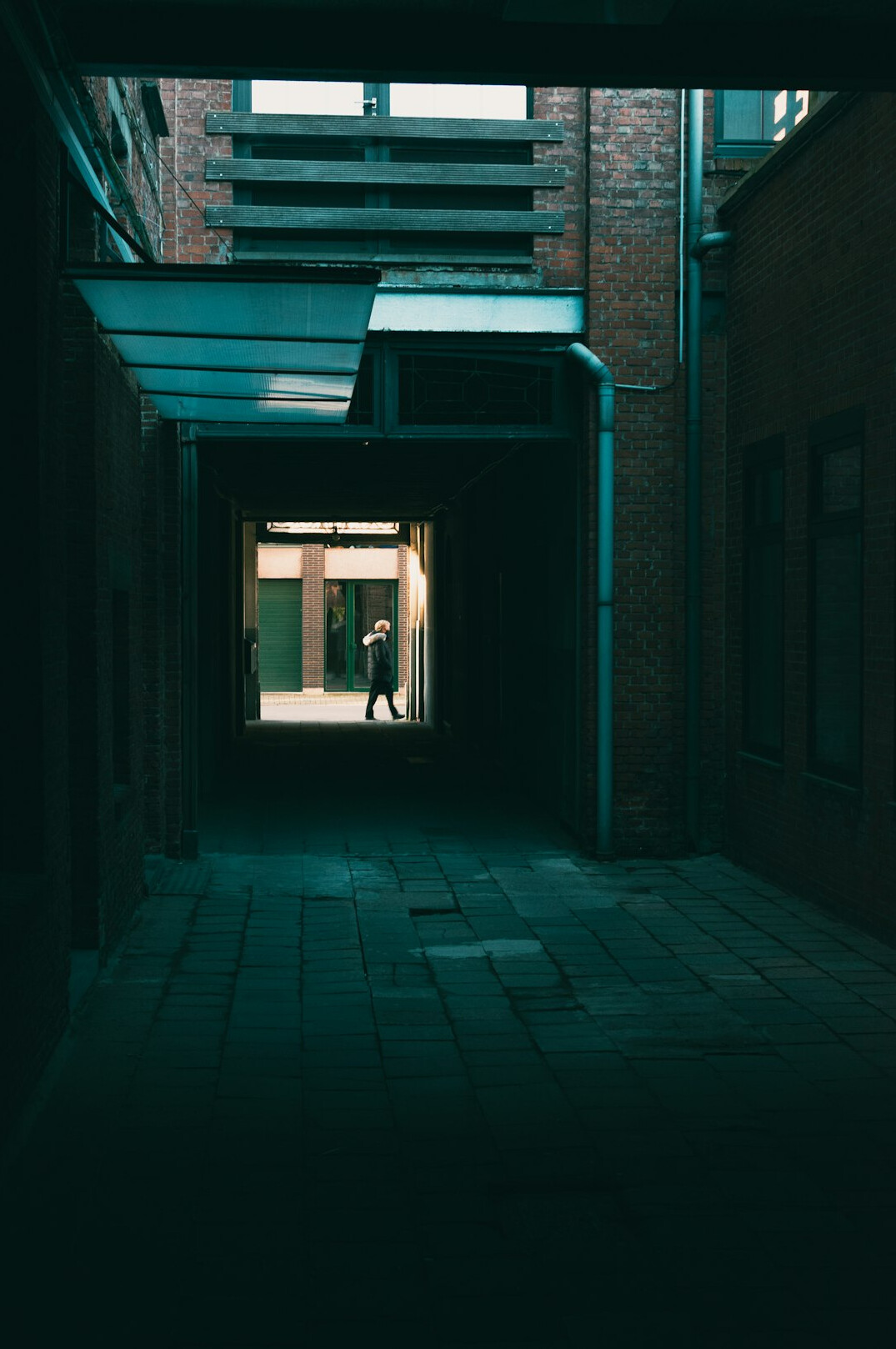 shadowy figure in dark alley