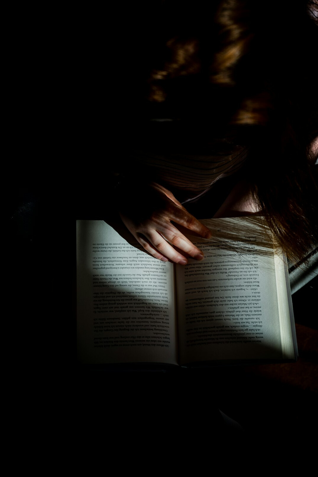 shadowy figure reading book