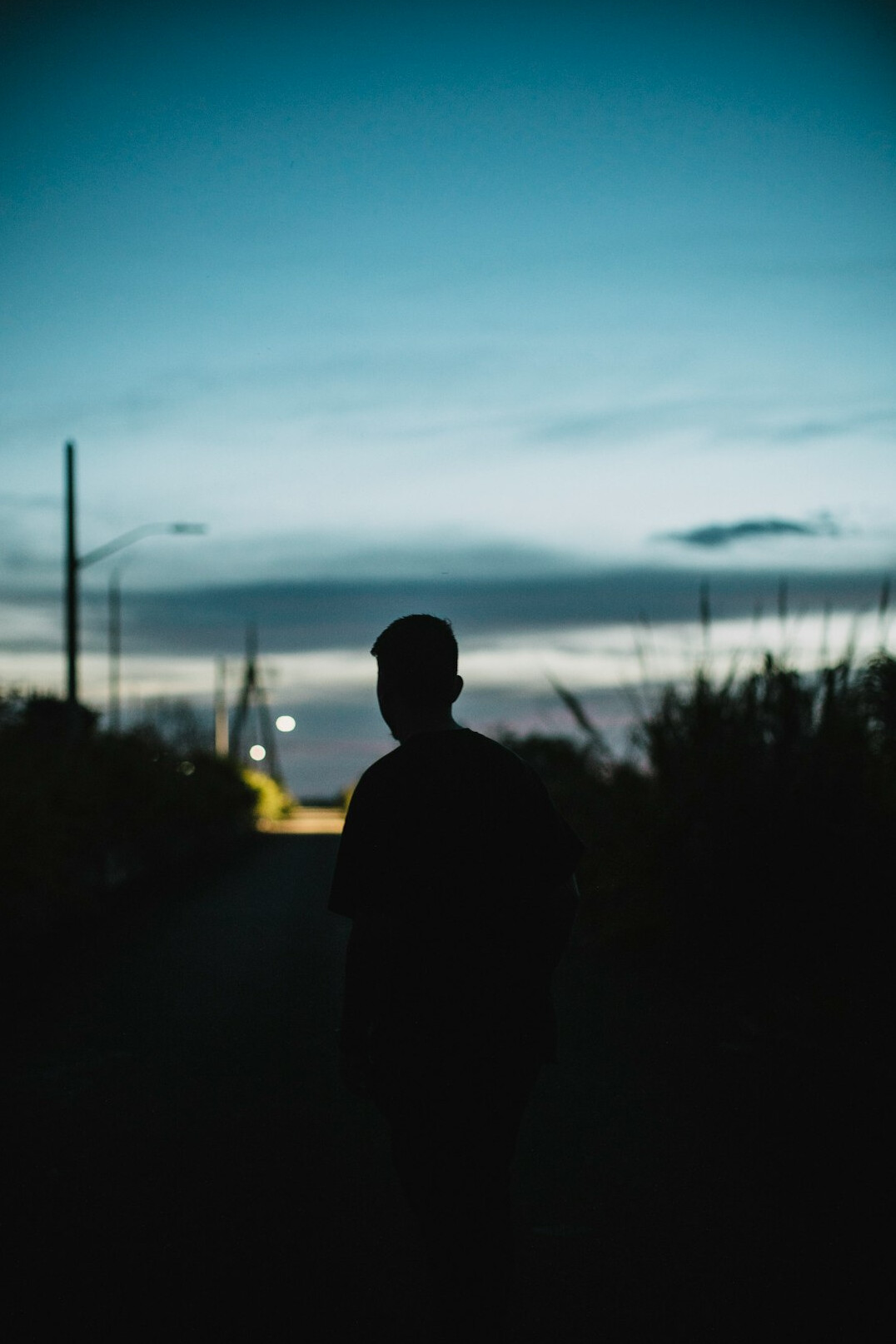 person walking alone at night